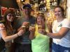 A couple and guide drinking craft beer at Beyond Pale microbrewery during their private bike and food tour of Ottawa 