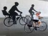 A guest is looking at biking street art mural in Little Italy during during best of Ottawa Neighbourhood and nature bike tour