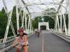 Tour participants are happily cycling on Minto bridge in new Edinburgh neighbourhood during Ottawa highlights bike tour 